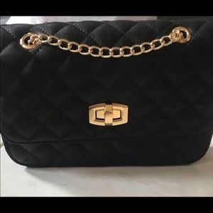 Quilted clutch with gold chain